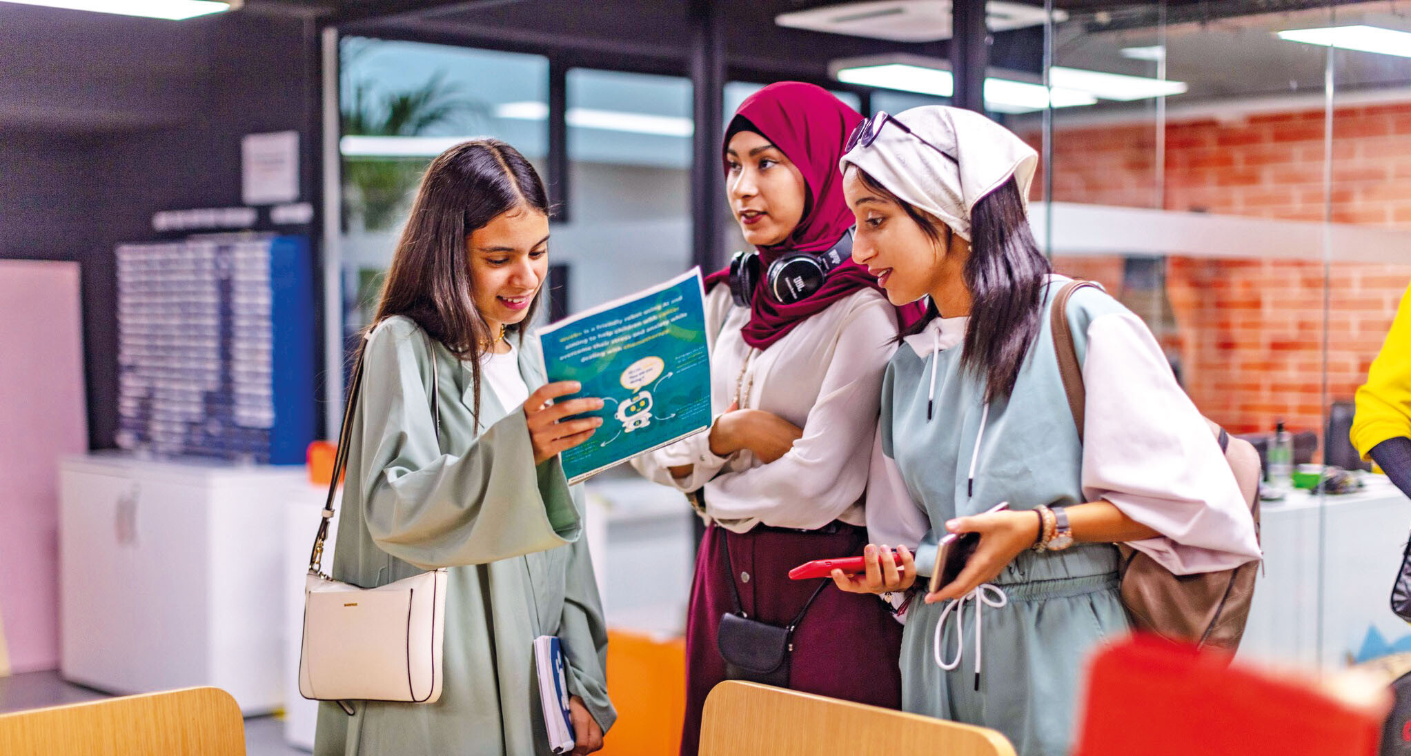 three young students chatting