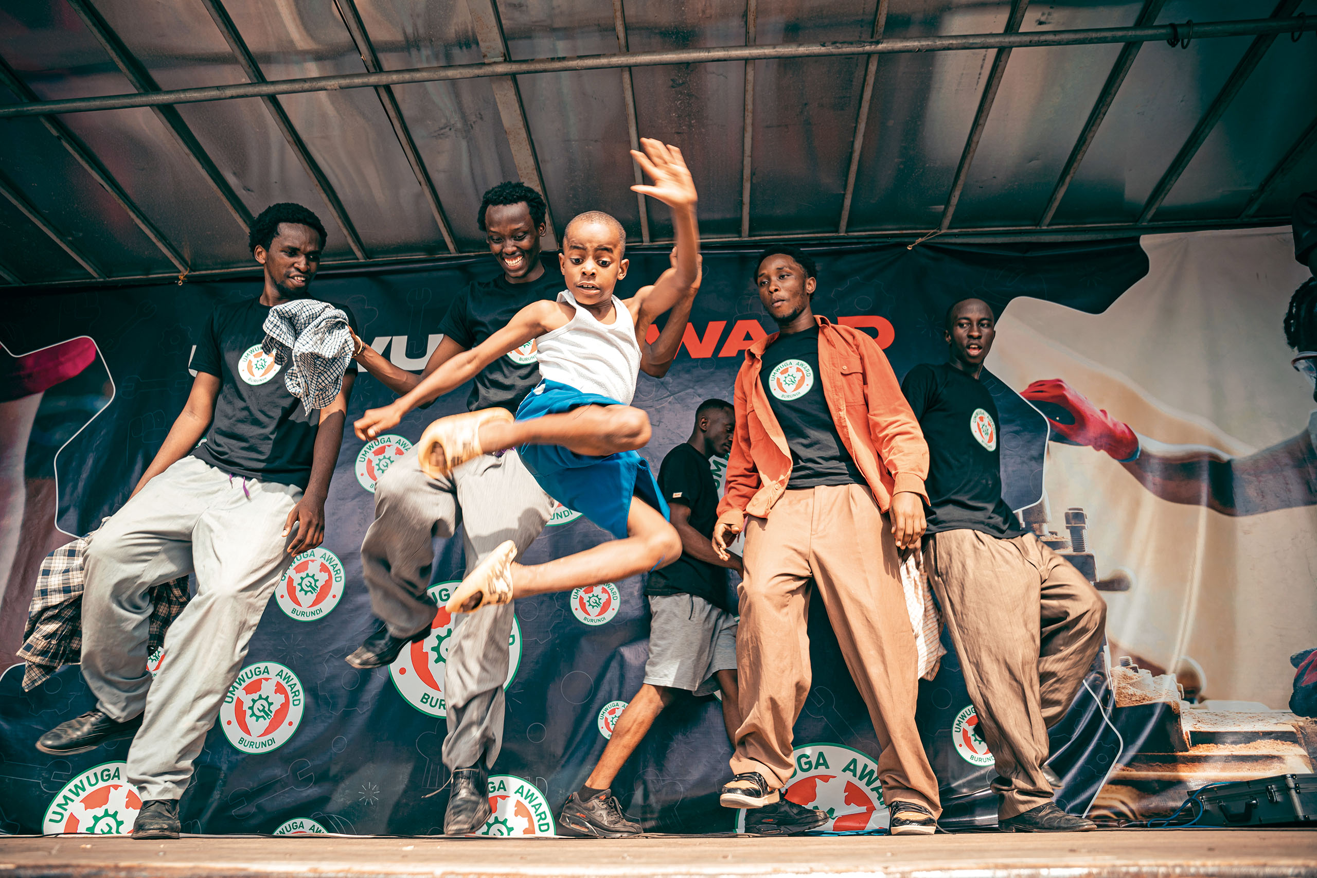 kid jumping on a stage